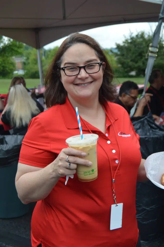 Fleet Response Employee Holding a Drink during Lunch Break