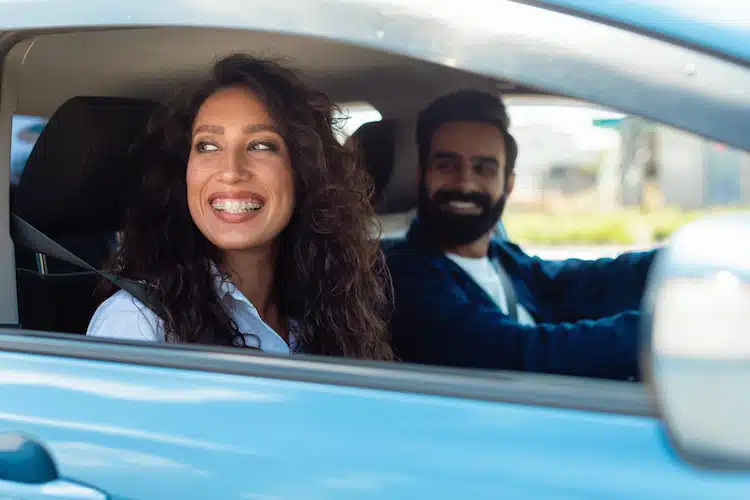 driver and passenger smiling 