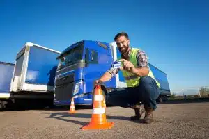 fleet driver placing safety cone on the road for fleet safety training