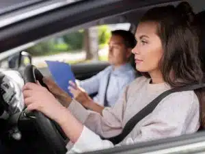 car driving school instructor and young driver